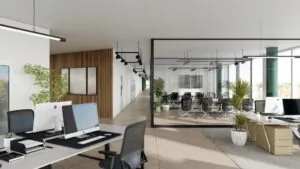 Moderne kantooruimte aan het John M. Keynesplein met werkplekken, glazen vergaderruimte en veel natuurlijk licht.